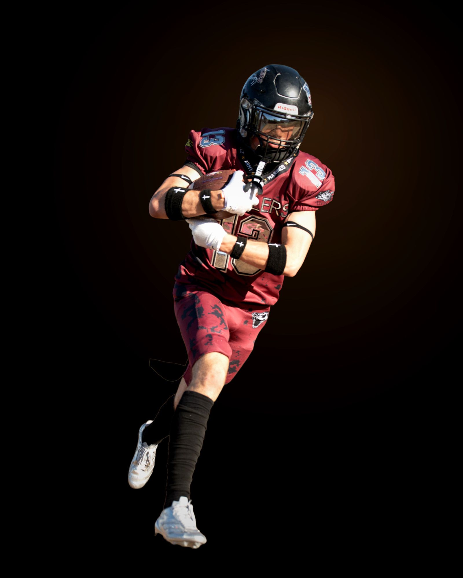 Jack Shepherd carrying the ball in stride, both arms wrapped around it.